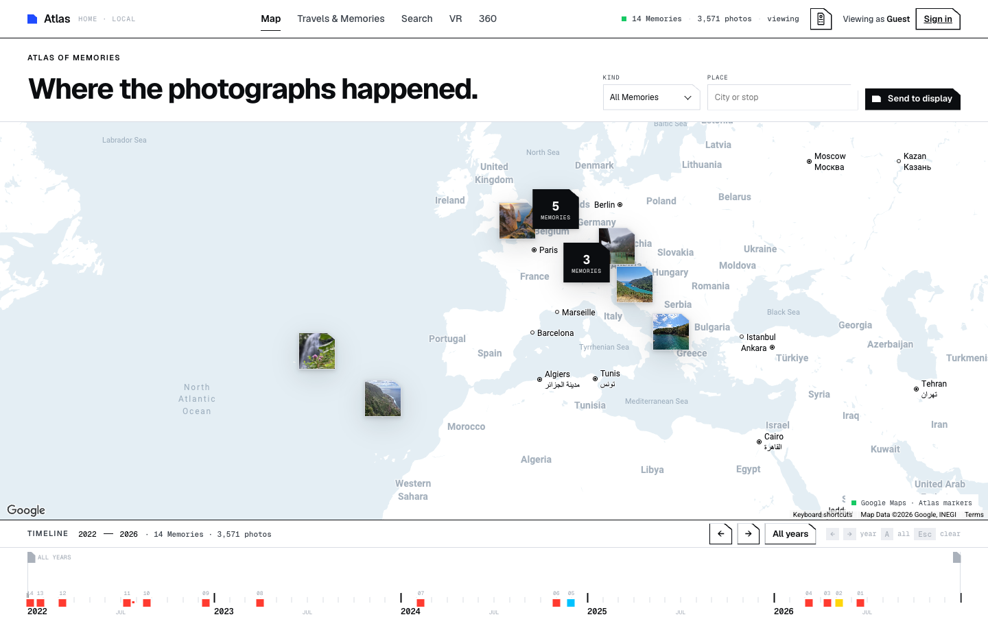 Atlas world map with photo clusters and a shared timeline